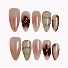 Mocha Petal Gilding press-on nails in Nude, Brown, Gold on a white background