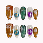 Ornament Snowfall Waltz press-on nails in Orange, Green, Purple on a white background