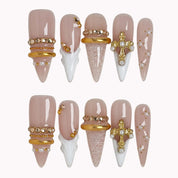 Ivory Baroque Halo press-on nails in Nude, White, Gold on a white background