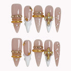 Ivory Baroque Halo press-on nails in Nude, White, Gold on a white background