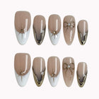 Pearl Star Bow press-on nails in Nude, White, Gold on a white background