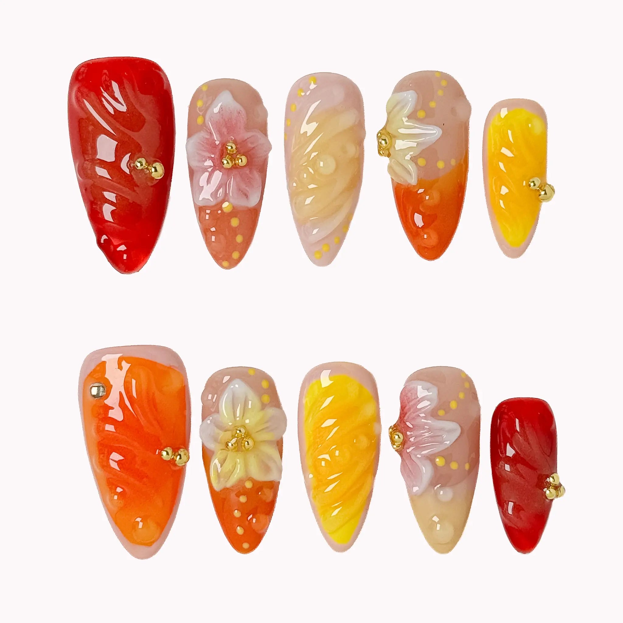 Harvest Citrus Bloom press-on nail set in Red, Orange, Yellow, Nude with red, orange, yellow and nude gradient design with raised flowers on a white background
