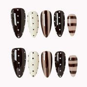 Cocoa Dot Rhythm press-on nail set in Brown, Nude, White with brown, nude and white design with polka dots and stripes on a white background