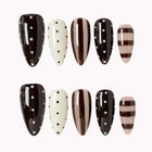 Cocoa Dot Rhythm press-on nail set in Brown, Nude, White with brown, nude and white design with polka dots and stripes on a white background