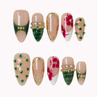 Emerald Garden Relic press-on nail set in Green, Gold, Nude, Red, White with green, gold and nude design with red florals and raised crystals on a white background