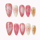Blush Petal Veil press-on nail set in Pink, White, Gold with pink and white ombre design with sculpted flowers and gold accents on a white background