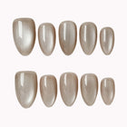 Silver Taupe Halo press-on nail set in Brown, Silver with cool taupe cat-eye design with a silver reflective finish on a white background