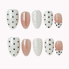 Porcelain Dot Muse press-on nail set in Black, White, Nude, Silver with white, nude and black design with polka dots and raised texture on a white background
