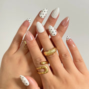 Porcelain Dot Muse medium almond press-on nails worn on hands, view 1