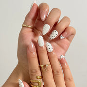 Porcelain Dot Muse medium almond press-on nails worn on hands, view 2
