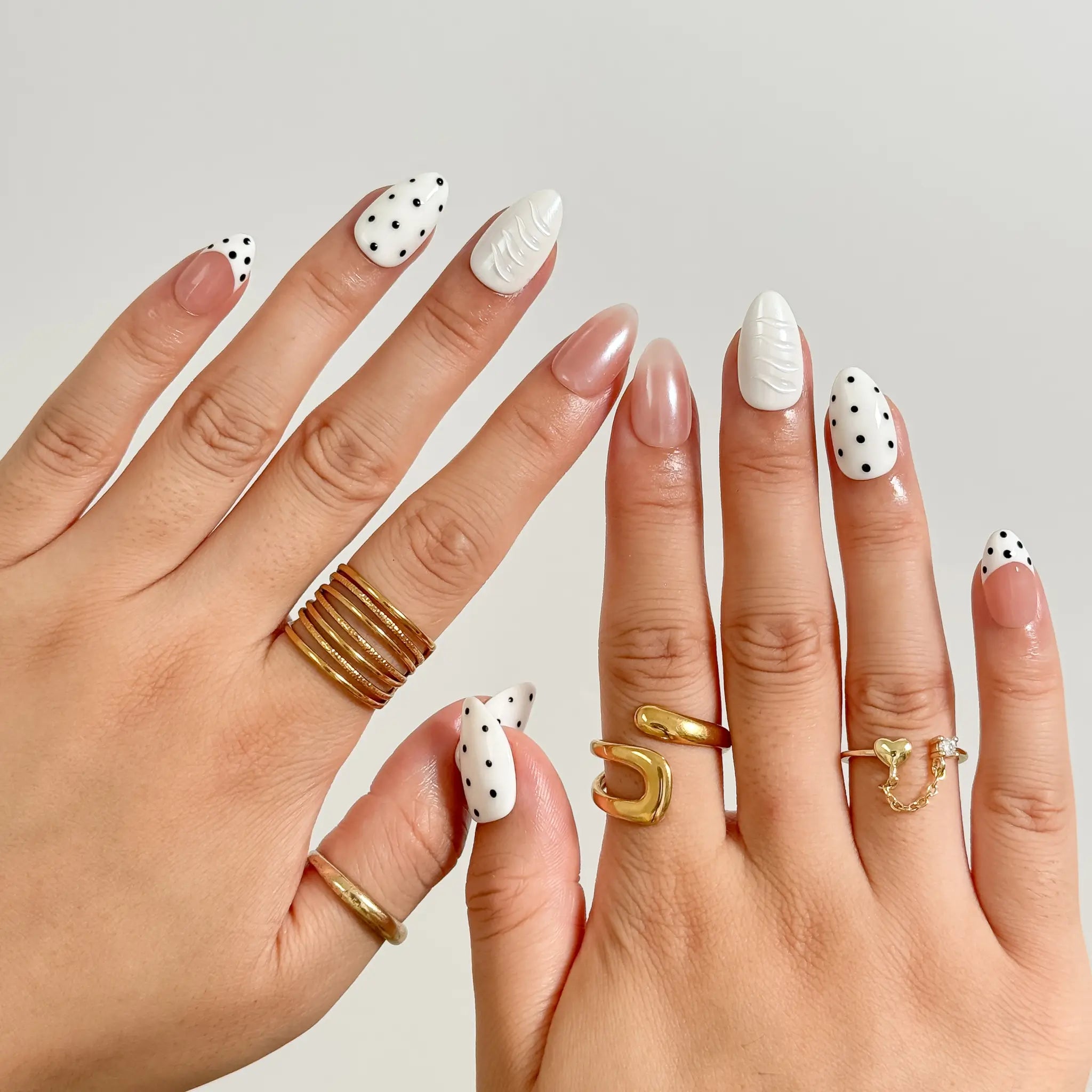 Porcelain Dot Muse medium almond press-on nails worn on hands, view 4