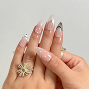 Noir Lace Whisper long almond press-on nails worn on hands, view 3