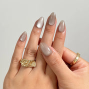 Silver Taupe Halo medium almond press-on nails worn on hands, view 3