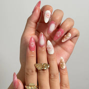 Blush Petal Veil medium almond press-on nails worn on hands, view 2