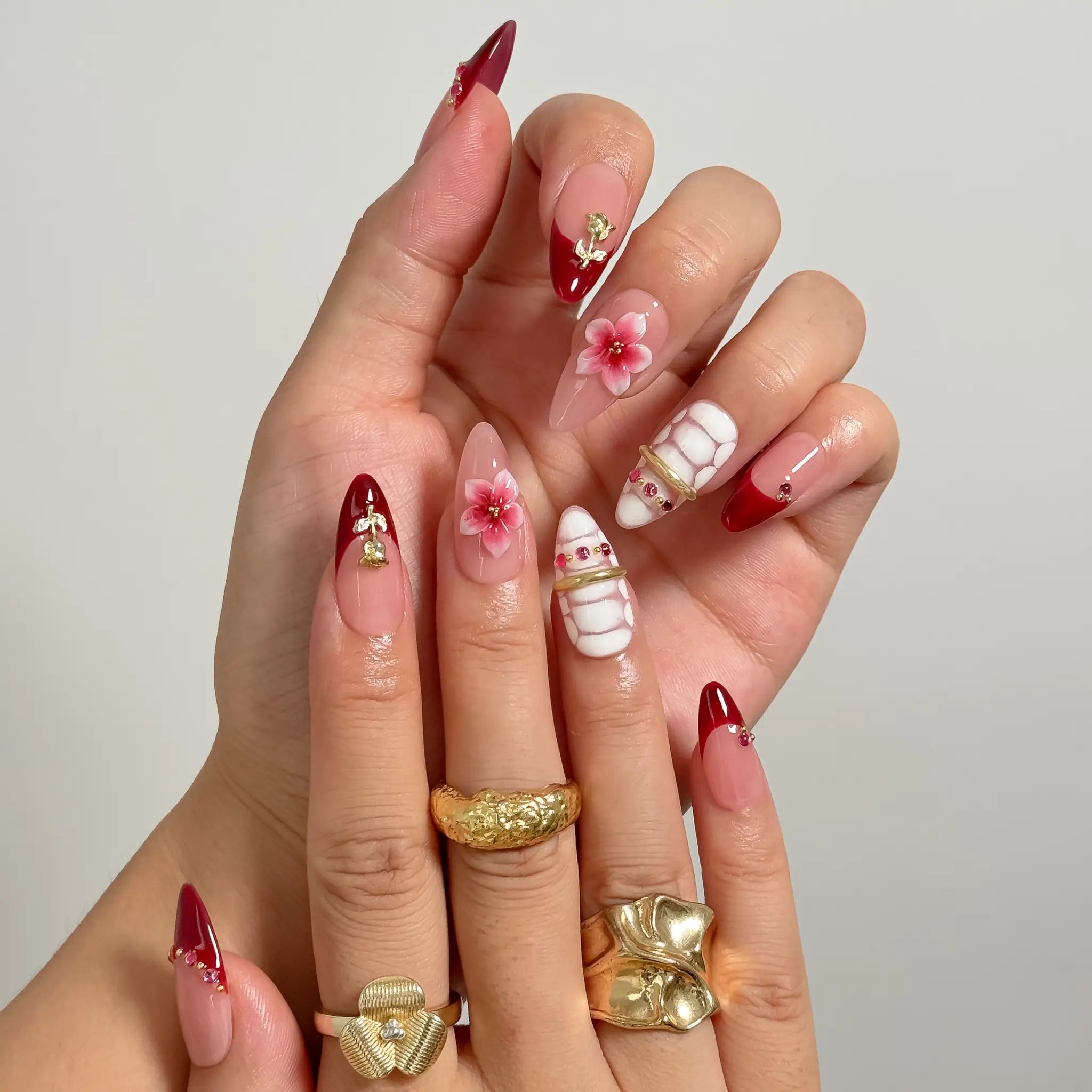 Crimson Garden Jewel medium almond press-on nails worn on hands, view 2