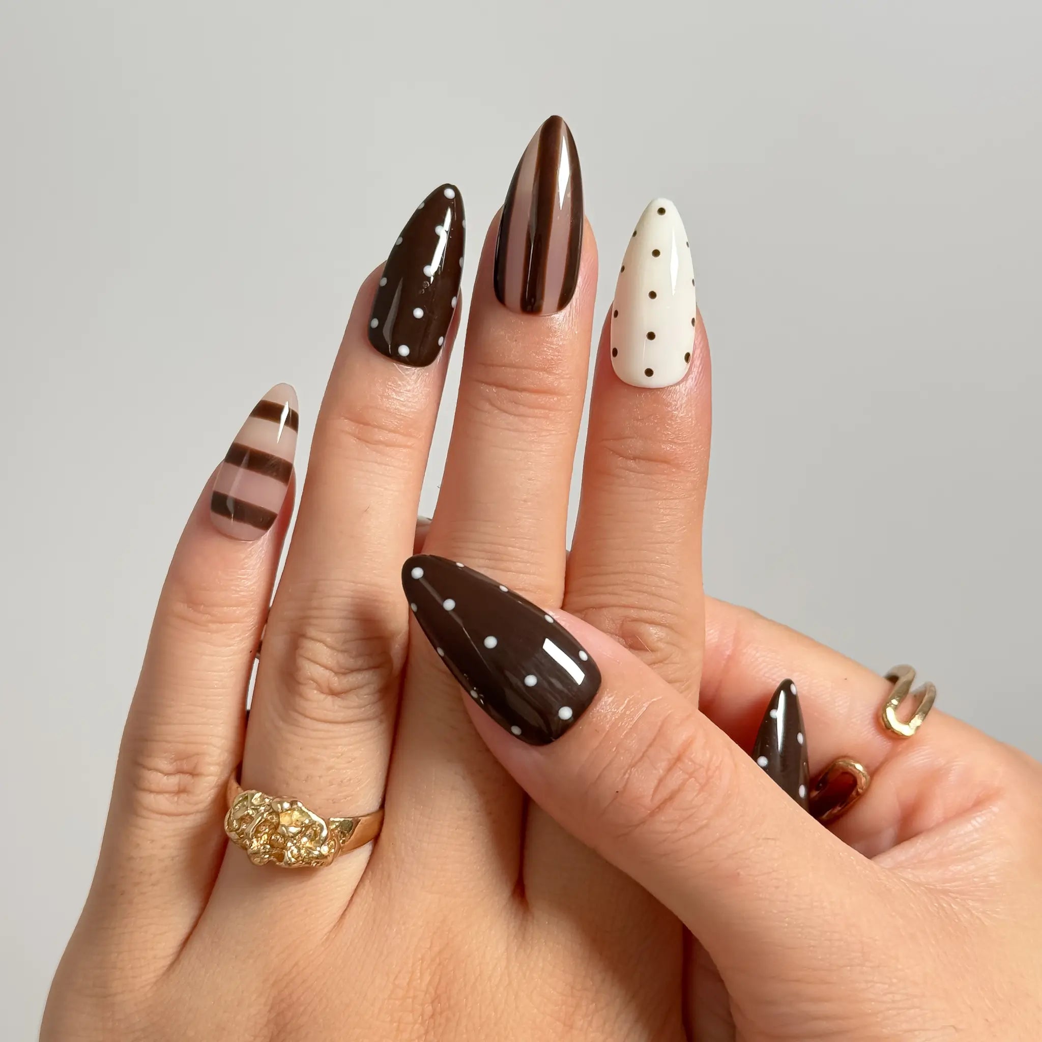 Cocoa Dot Rhythm medium almond press-on nails worn on hands, view 3