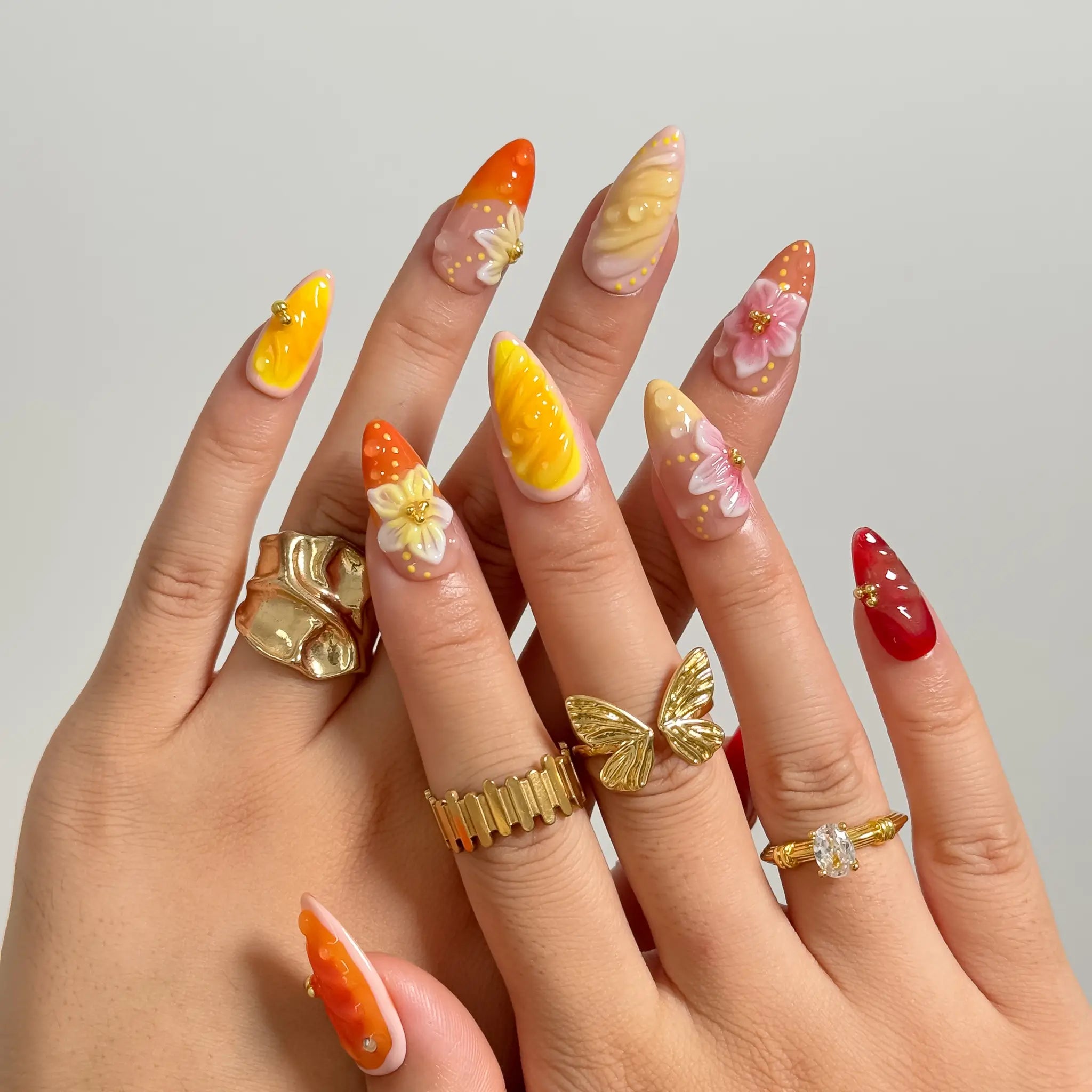 Harvest Citrus Bloom long almond press-on nails worn on hands, view 1