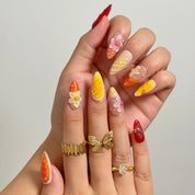 Harvest Citrus Bloom long almond press-on nails worn on hands, view 2