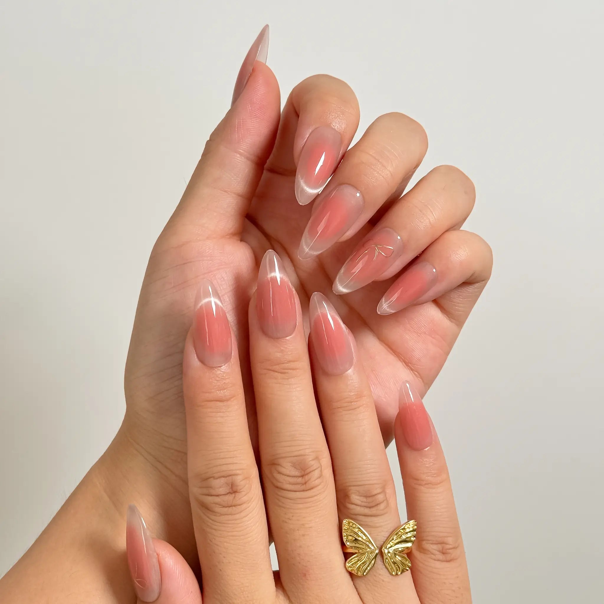 Roseglass Star Aura long almond press-on nails worn on hands, view 2