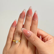 Roseglass Star Aura long almond press-on nails worn on hands, view 3