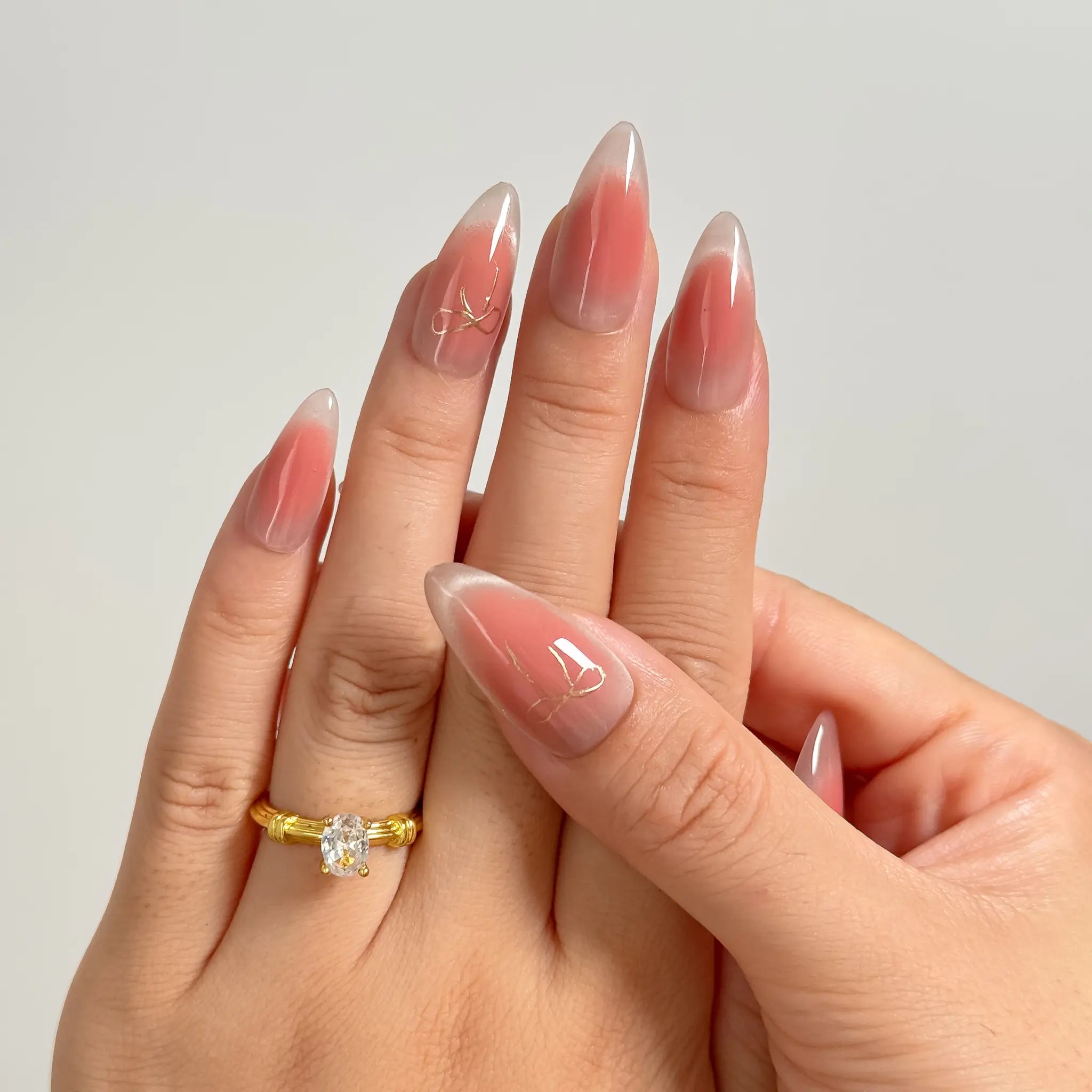 Roseglass Star Aura long almond press-on nails worn on hands, view 3