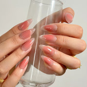 Roseglass Star Aura long almond press-on nails worn on hands, view 4