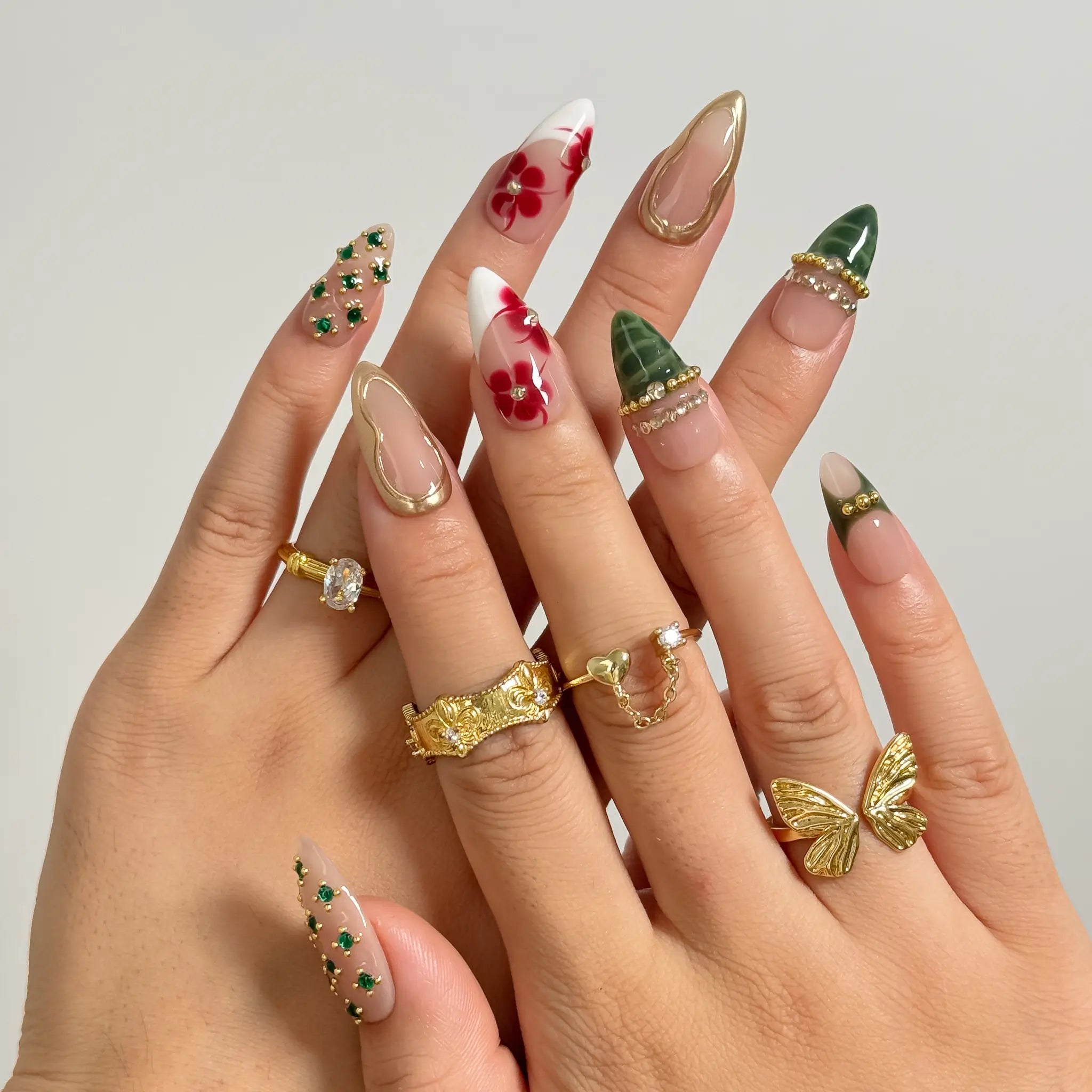 Emerald Garden Relic long almond press-on nails worn on hands, view 1