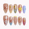Seashell Garden Reverie press-on nails in pink, blue, coral, yellow, and nude with shells, flowers, starfish, pearls, and 3D details